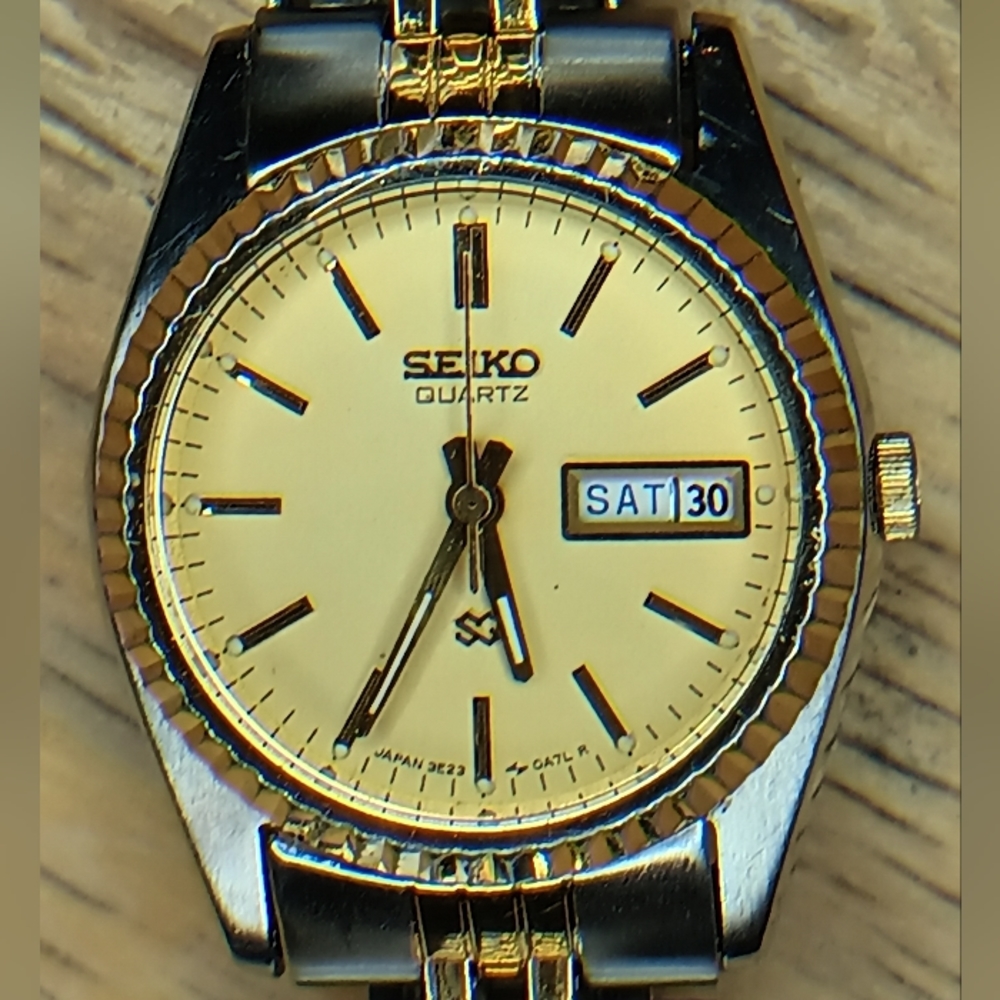 X Seiko SQ 24mm case, gold tone dial, fluted bezel, SS, silver, gold tone